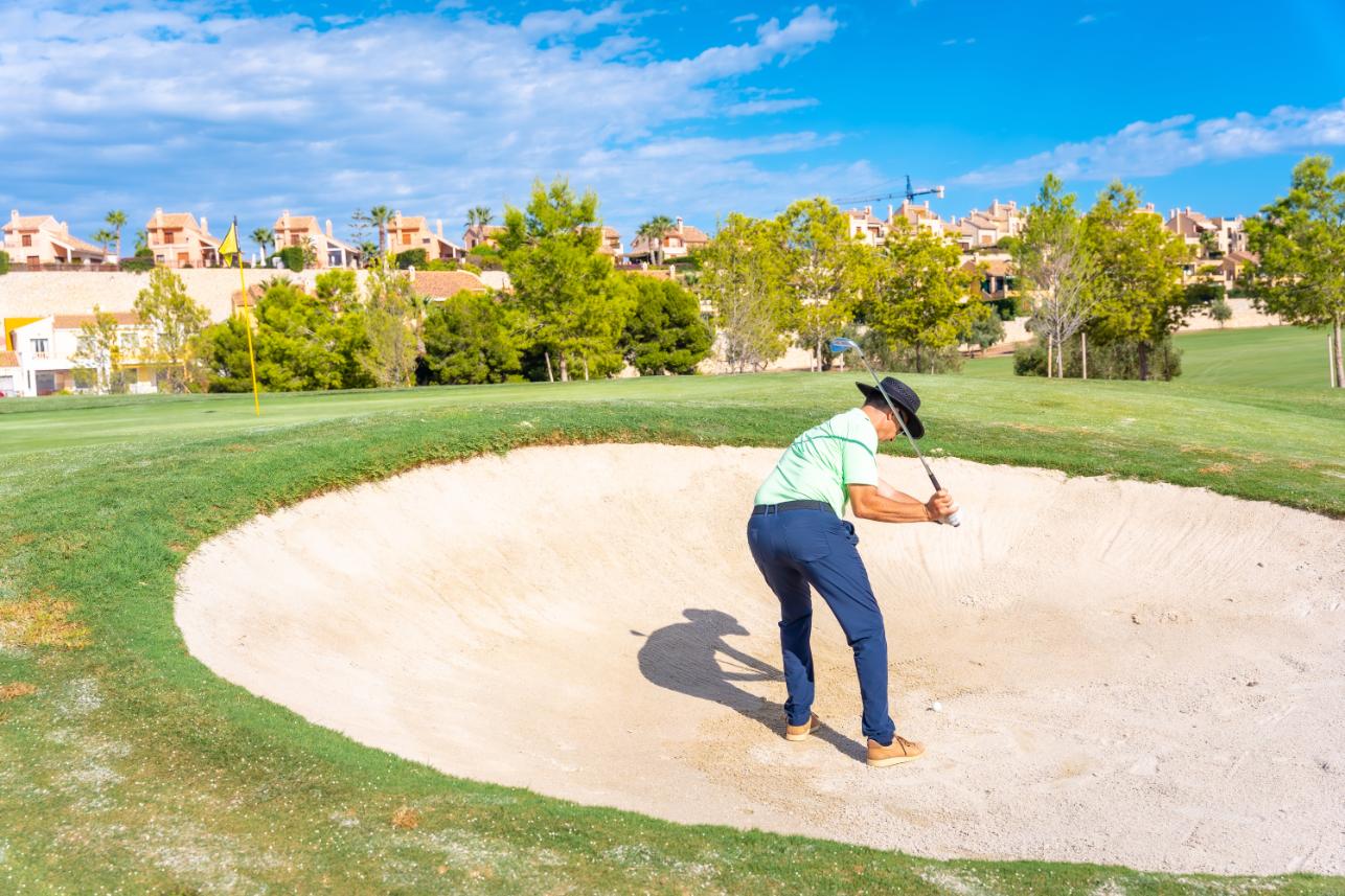 man-playing-golf-in-the-bunker-hitting-the-ball-w-2023-11-27-04-59-14-utc