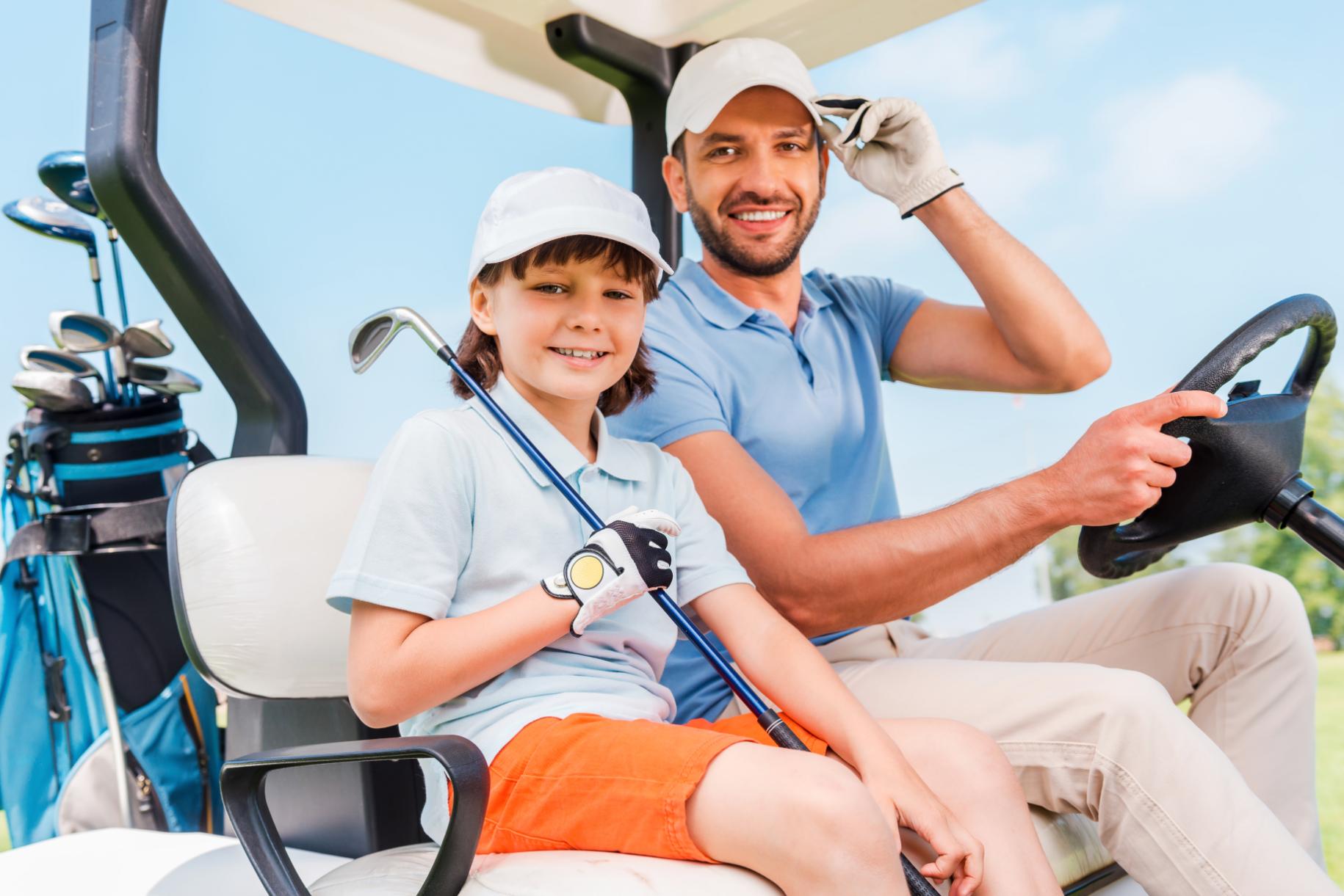 two-smiling-golfers-happy-young-man-and-his-littl-2023-11-27-05-17-52-utc